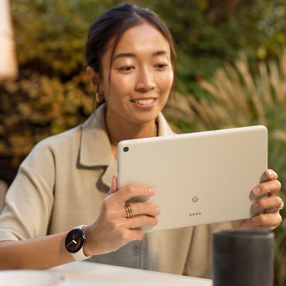 A woman checking the next day's weather on the tablet