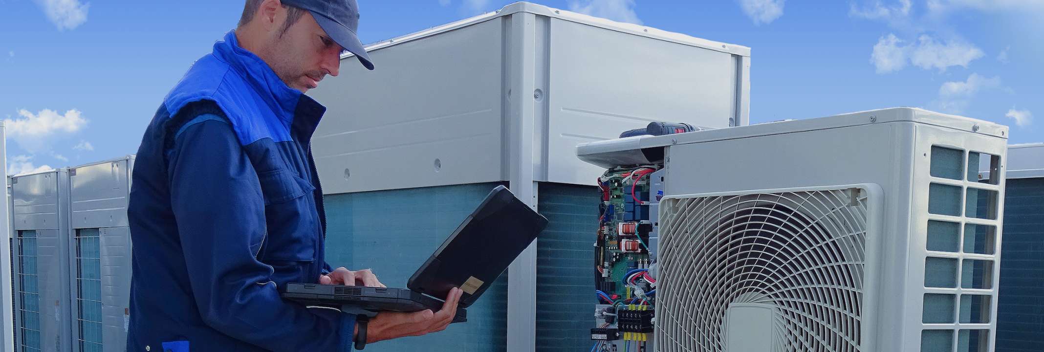 A technician working on a building’s HVAC system.