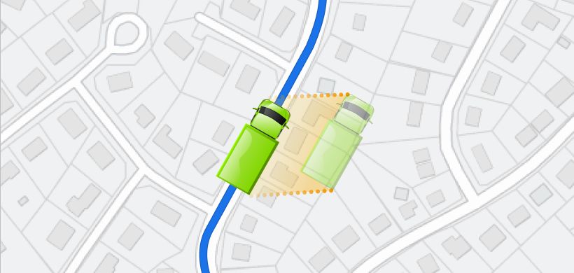 Top-down map showing a green truck on a blue path with a ghost truck in an orange shaded geofence.