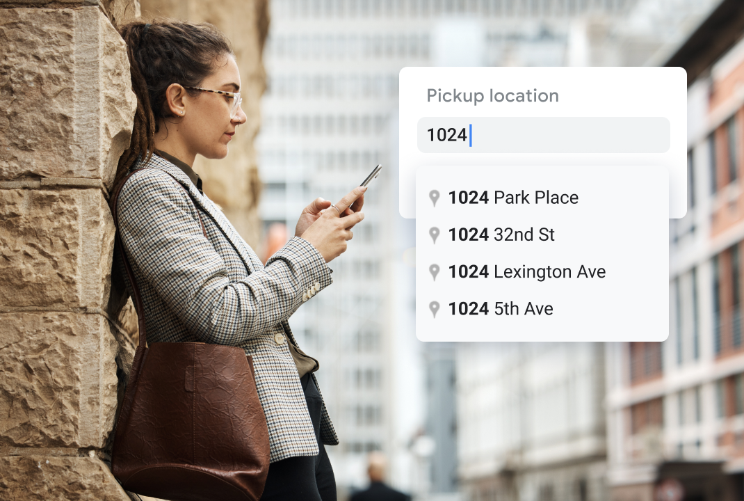 A woman searching for addresses on her phone.