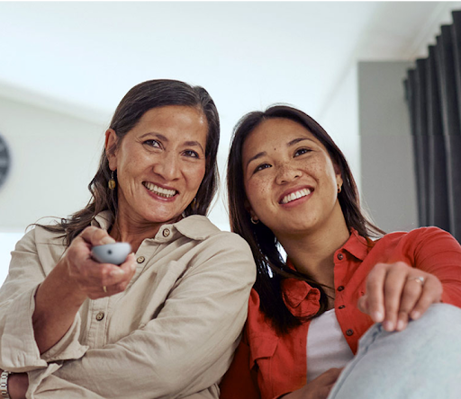 Image of a mother and daughter using a Google TV streamer